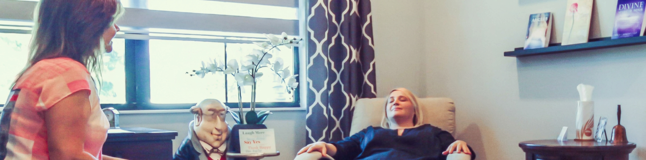 Susan Lawrence guiding a client into hypnosis at the GetJoyful.com office